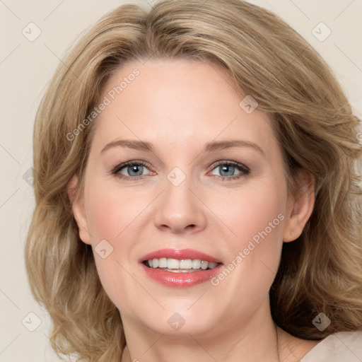 Joyful white young-adult female with medium  brown hair and blue eyes