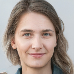 Joyful white young-adult female with medium  brown hair and blue eyes