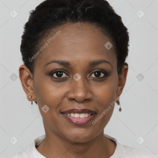 Joyful black young-adult female with short  brown hair and brown eyes