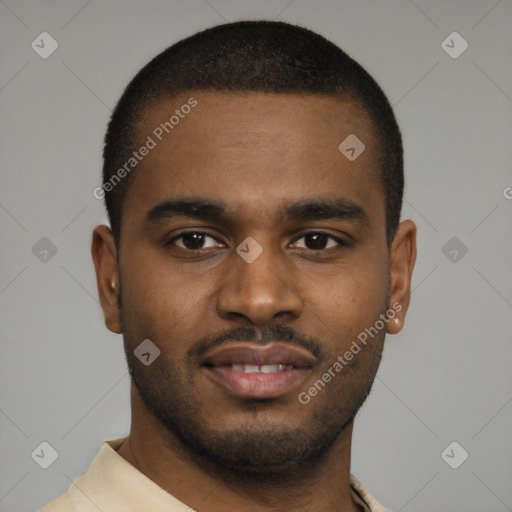 Joyful black young-adult male with short  brown hair and brown eyes