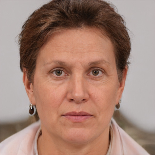 Joyful white adult female with short  brown hair and brown eyes