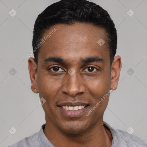 Joyful latino young-adult male with short  black hair and brown eyes