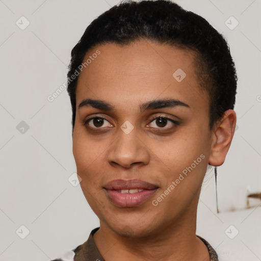 Joyful latino young-adult female with short  black hair and brown eyes