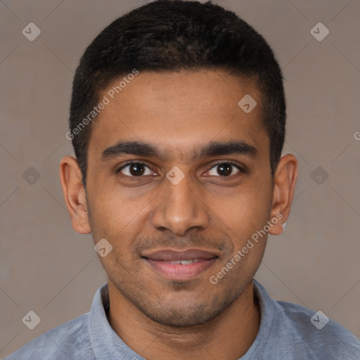 Joyful black young-adult male with short  brown hair and brown eyes