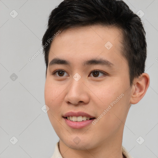 Joyful asian young-adult male with short  brown hair and brown eyes