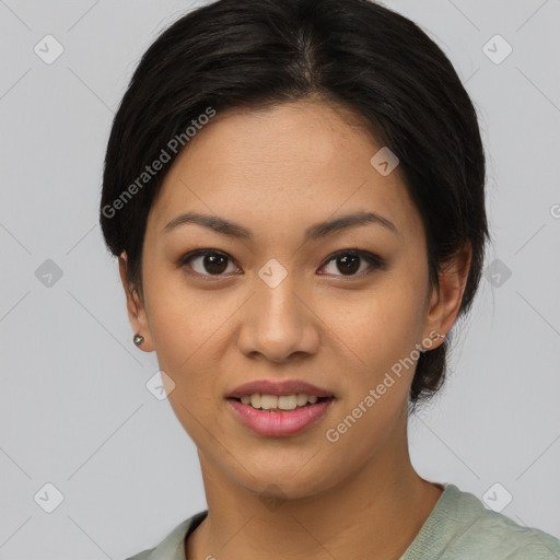 Joyful asian young-adult female with short  black hair and brown eyes