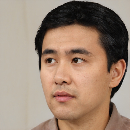 Neutral asian young-adult male with short  black hair and brown eyes