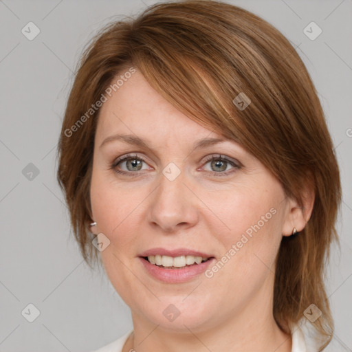 Joyful white adult female with medium  brown hair and blue eyes