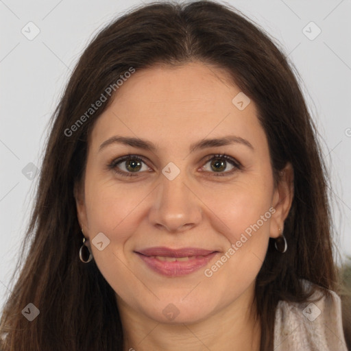 Joyful white adult female with long  brown hair and brown eyes