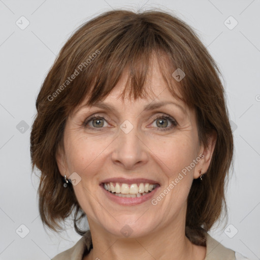 Joyful white adult female with medium  brown hair and grey eyes