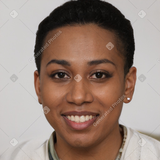 Joyful black young-adult female with short  brown hair and brown eyes