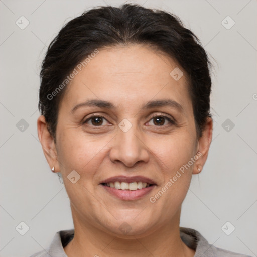 Joyful white adult female with short  brown hair and brown eyes