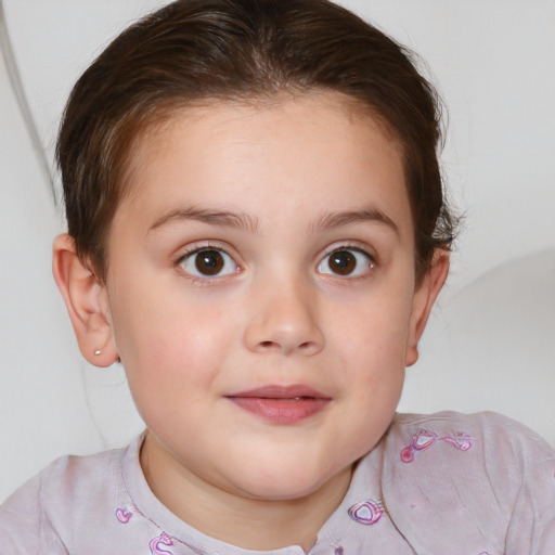 Joyful white child female with short  brown hair and brown eyes