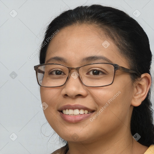 Joyful white adult female with medium  brown hair and brown eyes