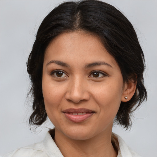 Joyful white adult female with medium  brown hair and brown eyes