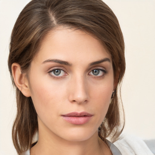 Neutral white young-adult female with medium  brown hair and green eyes