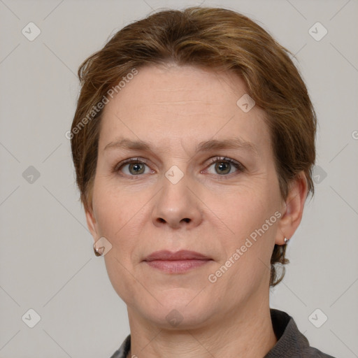 Joyful white adult female with short  brown hair and grey eyes