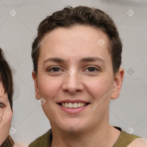 Joyful white young-adult female with short  brown hair and grey eyes