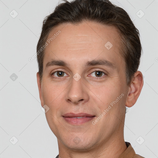 Joyful white adult male with short  brown hair and brown eyes