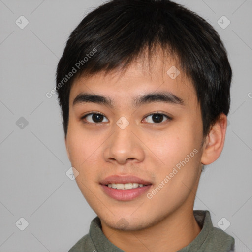 Joyful asian young-adult male with short  brown hair and brown eyes