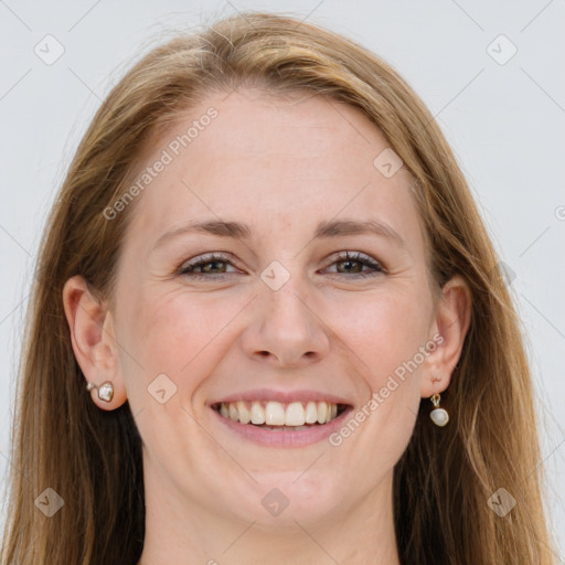 Joyful white young-adult female with long  brown hair and blue eyes