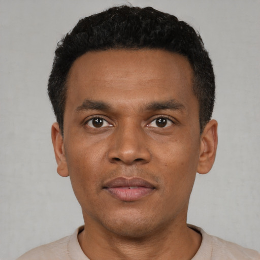 Neutral black young-adult male with short  black hair and brown eyes