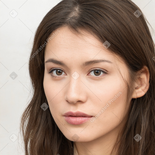 Neutral white young-adult female with long  brown hair and brown eyes