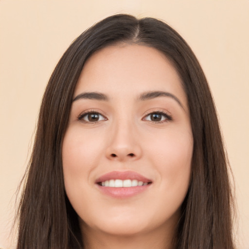 Joyful asian young-adult female with long  brown hair and brown eyes