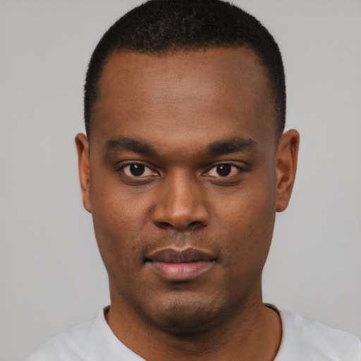 Neutral black young-adult male with short  black hair and brown eyes