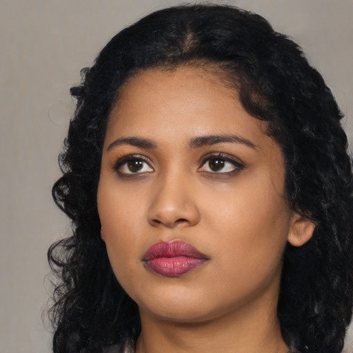 Neutral black young-adult female with long  black hair and brown eyes