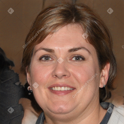 Joyful white adult female with medium  brown hair and blue eyes