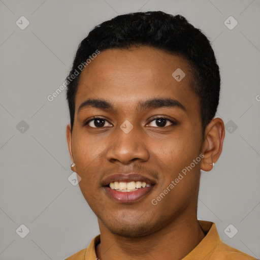 Joyful black young-adult male with short  black hair and brown eyes