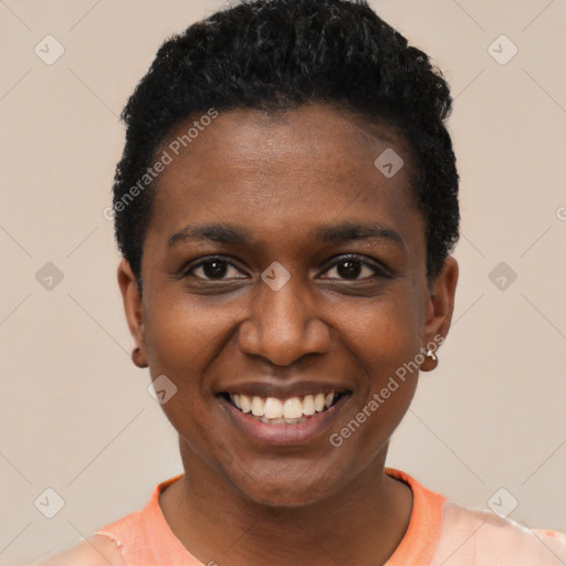 Joyful black young-adult female with short  black hair and brown eyes