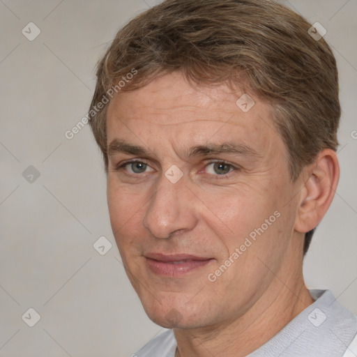 Joyful white middle-aged male with short  brown hair and brown eyes