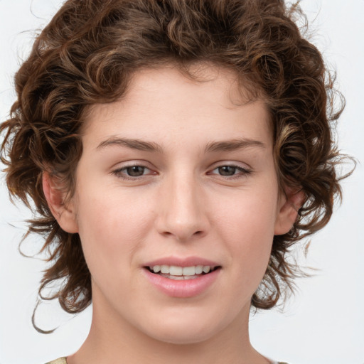 Joyful white young-adult female with medium  brown hair and green eyes