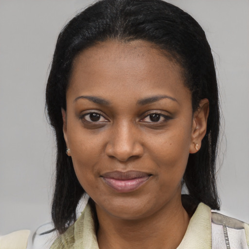 Joyful latino young-adult female with medium  black hair and brown eyes