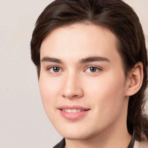 Joyful white young-adult male with medium  brown hair and brown eyes