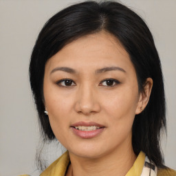 Joyful asian young-adult female with medium  brown hair and brown eyes