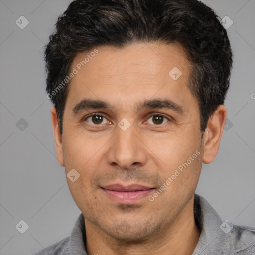 Joyful white young-adult male with short  black hair and brown eyes