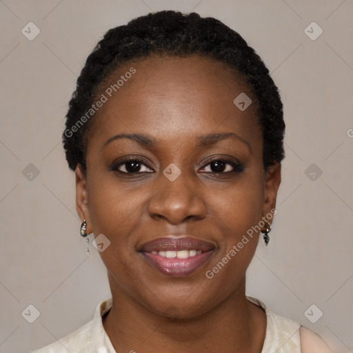 Joyful black young-adult female with short  black hair and brown eyes