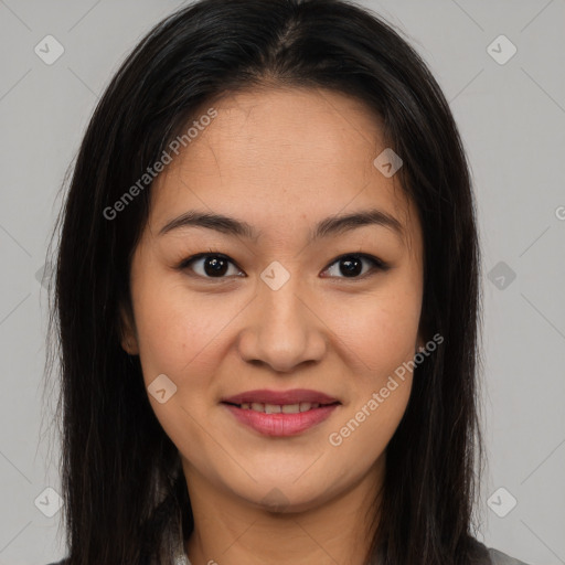 Joyful latino young-adult female with long  brown hair and brown eyes