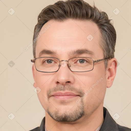 Joyful white adult male with short  brown hair and brown eyes