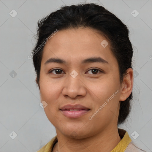 Joyful latino young-adult female with short  brown hair and brown eyes