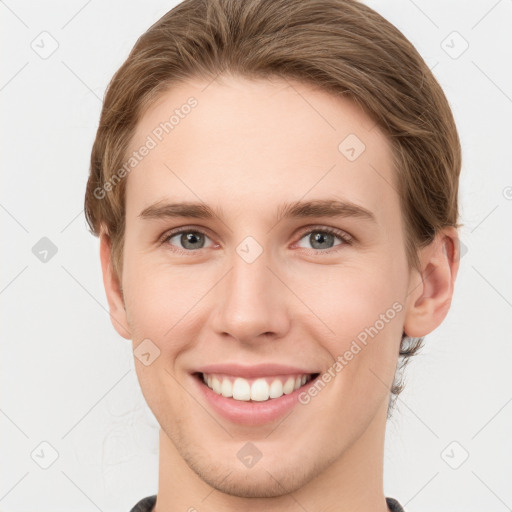 Joyful white young-adult female with short  brown hair and grey eyes