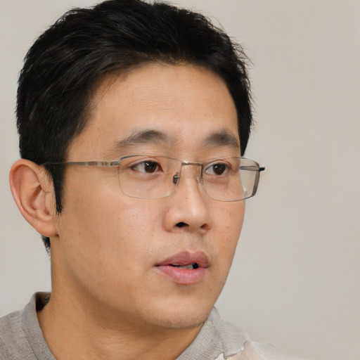 Neutral asian young-adult male with short  brown hair and brown eyes