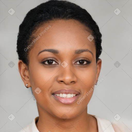 Joyful black young-adult female with short  black hair and brown eyes