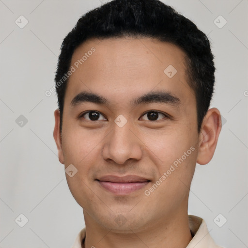 Joyful asian young-adult male with short  black hair and brown eyes