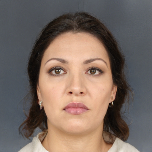 Neutral white young-adult female with medium  brown hair and brown eyes