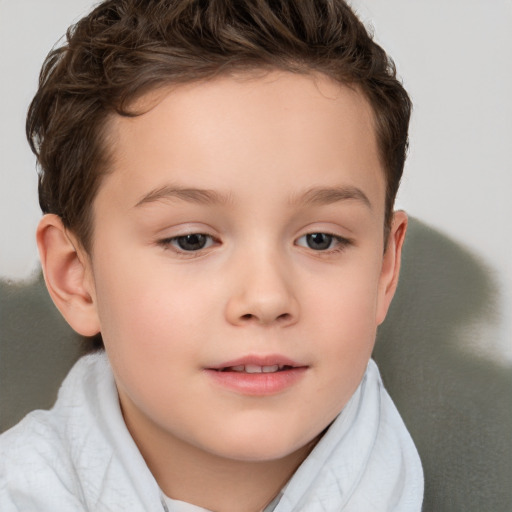 Joyful white child female with short  brown hair and brown eyes