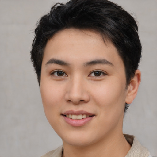 Joyful asian young-adult female with short  brown hair and brown eyes